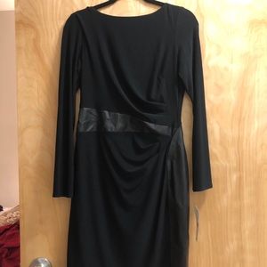 Black dress with waist accentuates.